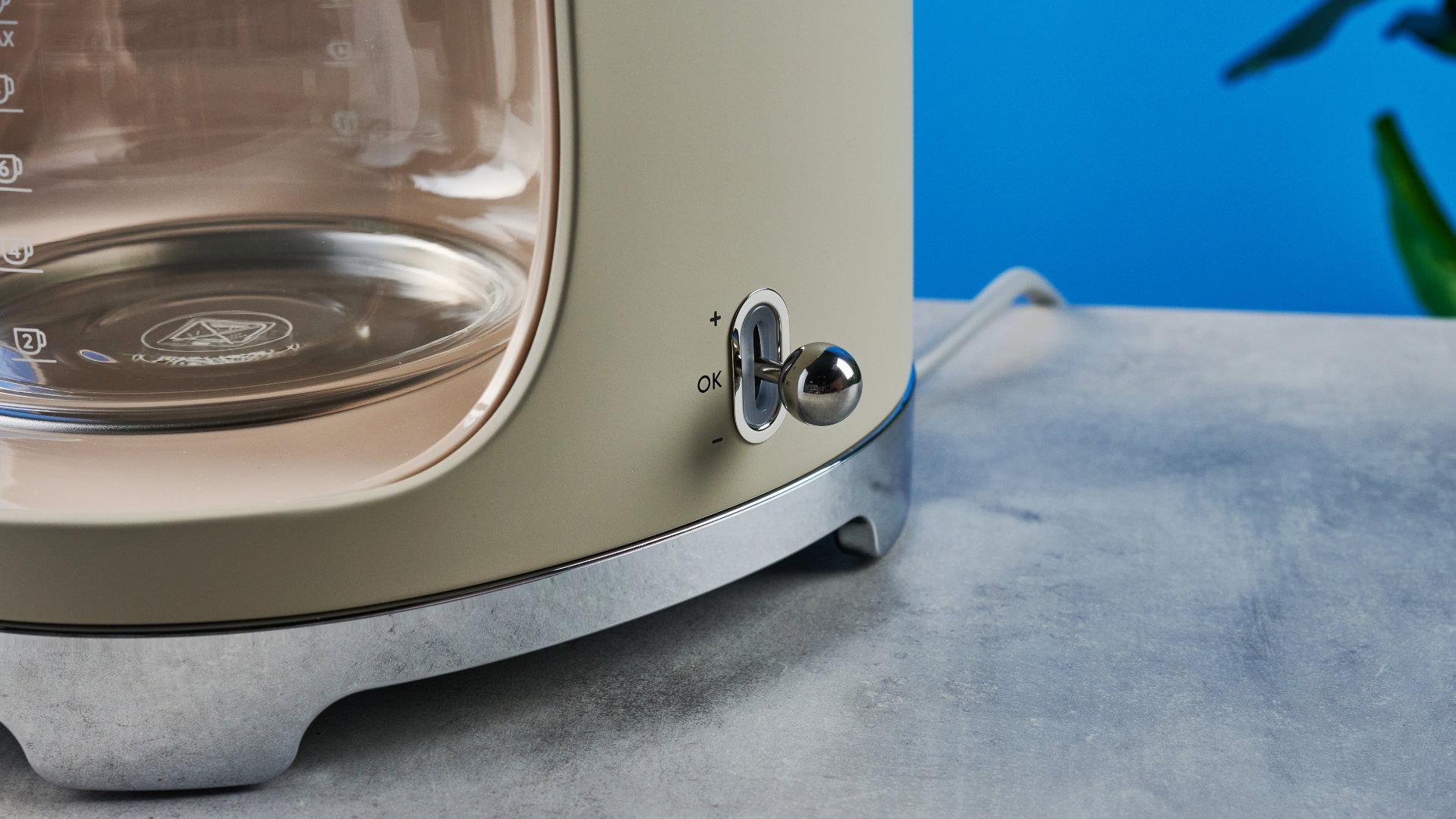 the smeg retro coffee maker photographed against the blue tom's guide background