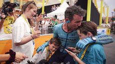 Astana Qazaqstan Team's British rider Mark Cavendish celebrates with his family at the end of the 21st and final stage of the 111th edition of the Tour de France cycling race, a 33,7 km individual time-trial between Monaco and Nice, on July 21, 2024. (Photo by Laurent Cipriani / POOL / AFP) (Photo by LAURENT CIPRIANI/POOL/AFP via Getty Images)