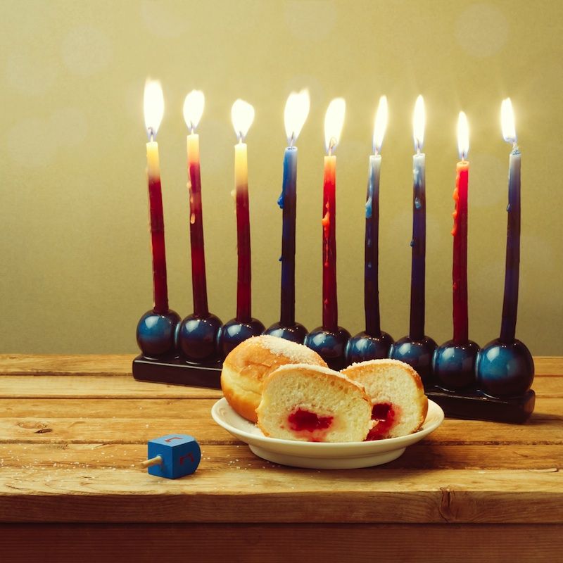 hanukkah menorah with jelly doughnuts