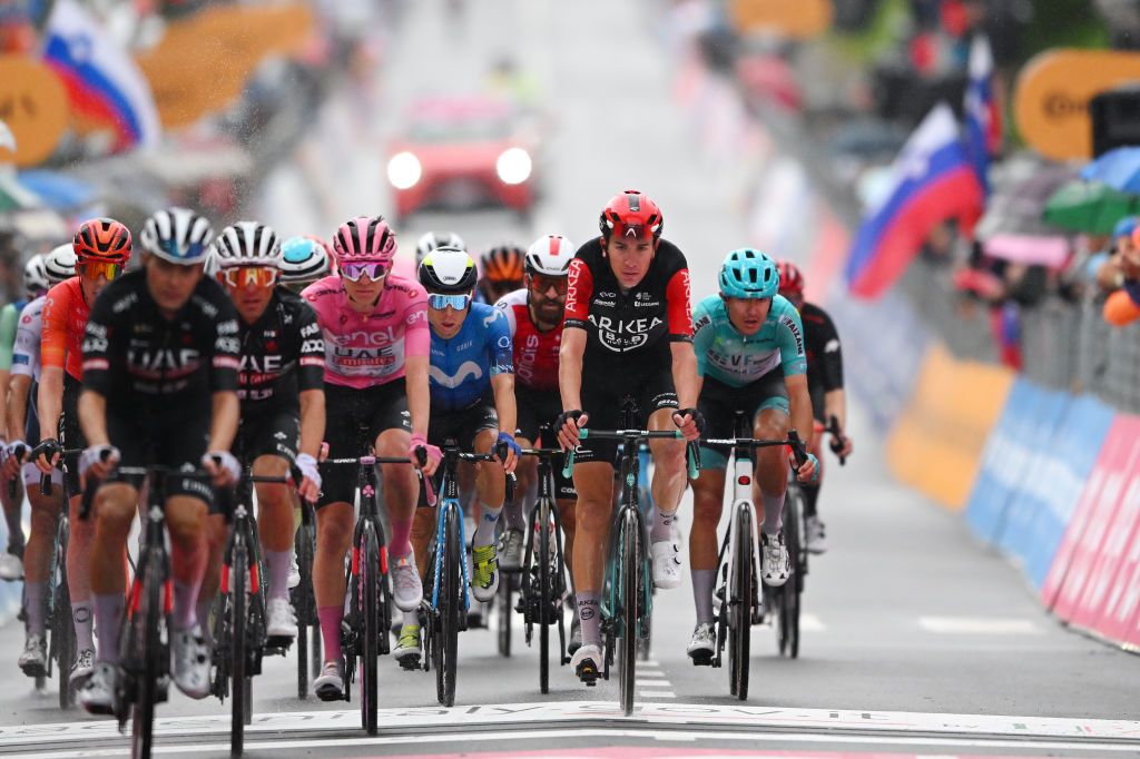 SAPPADA ITALY MAY 24 LR Tadej Pogacar of Slovenia and UAE Team Emirates Pink Leader Jersey Einer Rubio of Colombia and Movistar Team and Michel Ries of Luxembourg and Team Arkea BB Hotels cross the finish line during the 107th Giro dItalia 2024 Stage 19 a 157km stage from Mortegliano to Sappada 1236m UCIWT on May 24 2024 in Sappada Italy Photo by Tim de WaeleGetty Images
