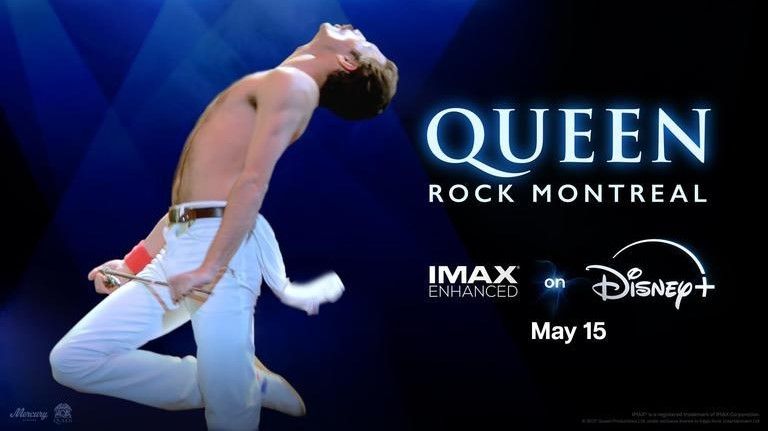 Freddie Mercury of Queen performing on a blue background with &quot;Queen Rock Montreal, IMAX Enhanced on Disney+, May 15&quot; written next to him 