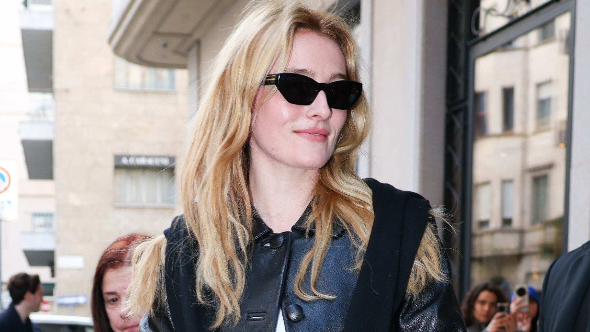 Sarah Pidgeon arrived at Milan Fashion Week wearing black cigarette jeans, a leather jacket, and a sweater on top