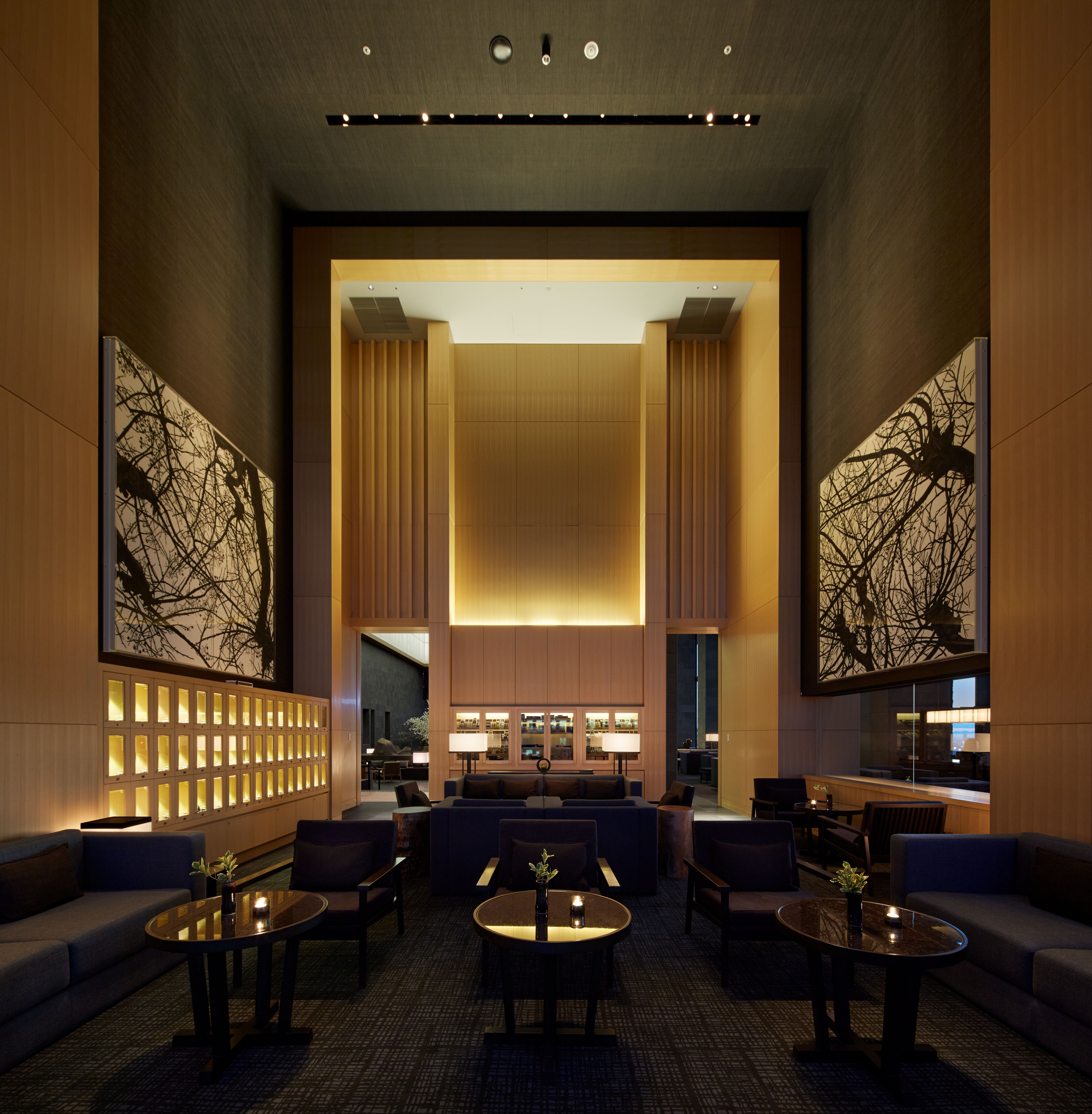 view of a serene hotel in tokyo, adorned with wooden furnishing, washi paper and natural stone touches