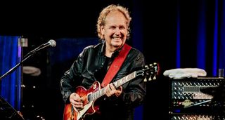 Lee Ritenour onstage with a Gibson Les Paul