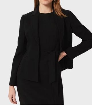 Image of woman wearing black blazer