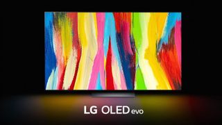 The LG C2 OLED on a black background with a rainbow pattern shown on-screen.