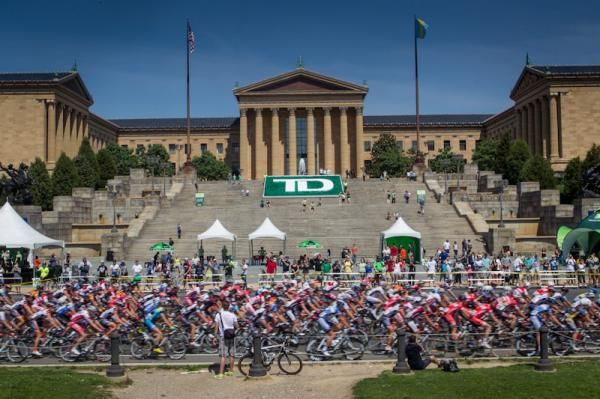 The men roll past the art museum.