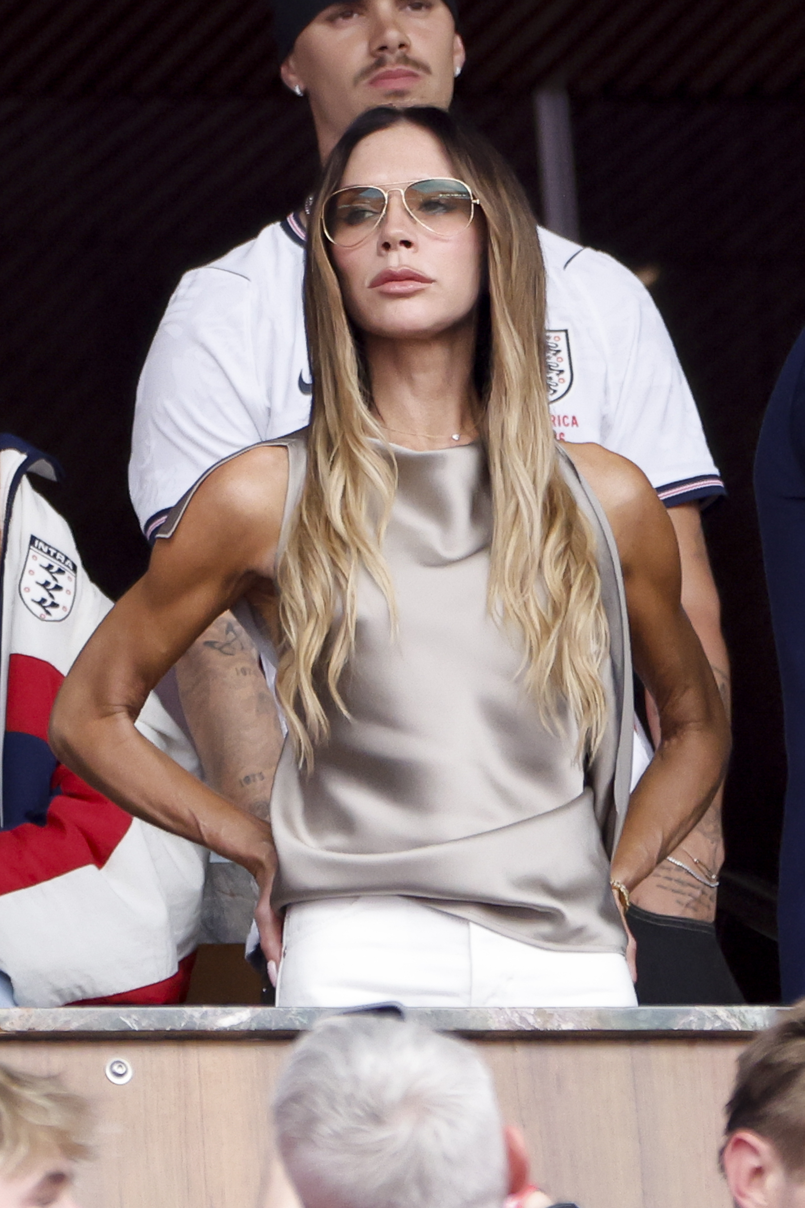 Victoria Beckham styled a satin cowl-neck top at the 2026 World Cup