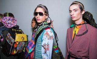 Female models wearing a variety of colourful accessories line up