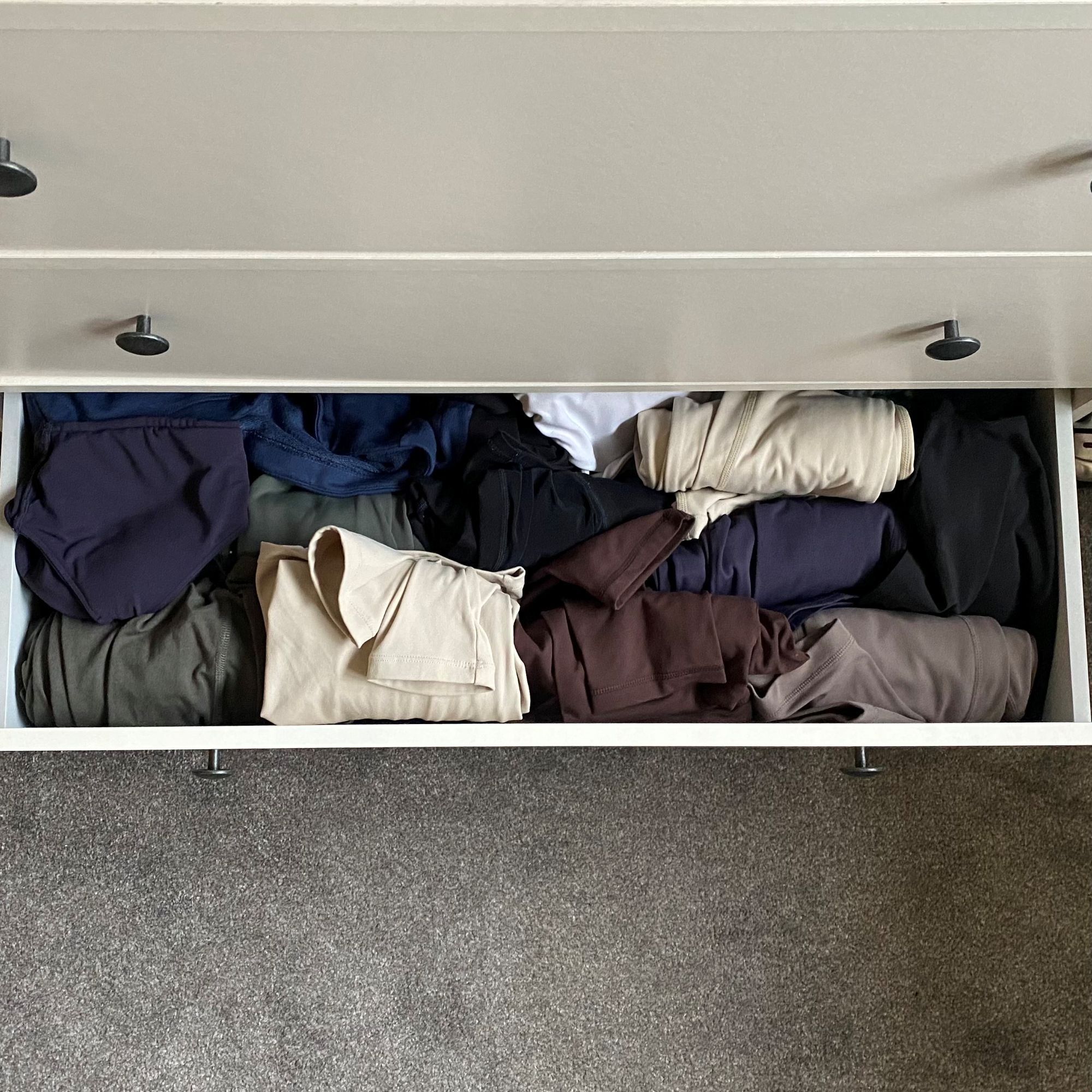 Katie trying the KonMari folding method to organise her clothes