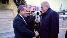 Iranian Foreign Minister Abbas Araghchi (L) arrives in St. Petersburg for diplomatic talks