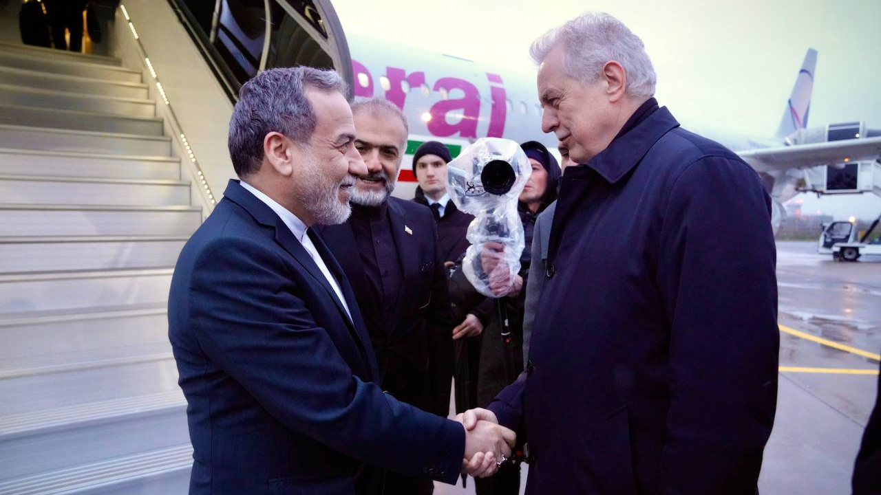 Iranian Foreign Minister Abbas Araghchi (L) arrives in St. Petersburg for diplomatic talks