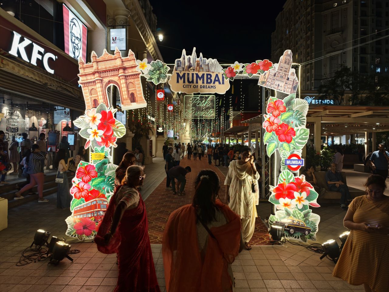 A Mumbai festival entrance at night.