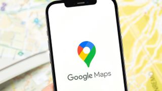 The Google Maps logo on an iPhone screen