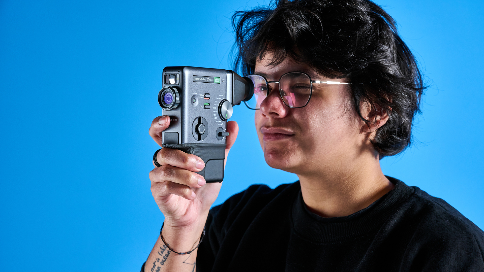 A Fujifilm Instax mini Evo Cinema hybrid instant camera