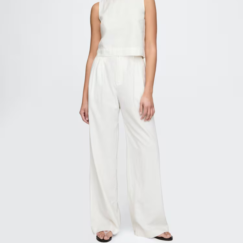A model wearing white wide-leg trousers