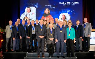 Michael Lopez-Alegria, Pam Melroy and Scott Kelly pose with their now fellow U.S. Astronaut Hall of Fame inductees at the Kennedy Space Center Visitor Complex, Nov. 13, 2021.