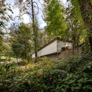 Casa El Pinar as it sits perched on a green hillside
