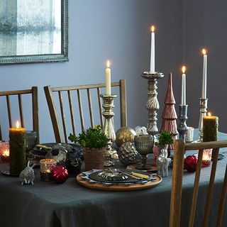 sophisticated christmas dining room with metallic candlesticks