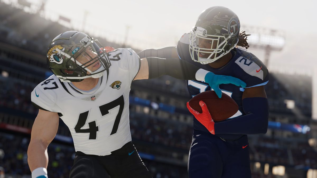 two madden players wrestling for the ball