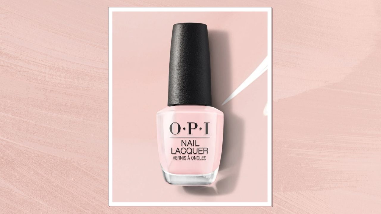 A product shot of OPI&#039;s Nail Lacquer in shade Put It In Neutral (which is a sheer, milky pink), pictured on a pink background - demonstrating the polishes colour - and featured in a pastel pink template