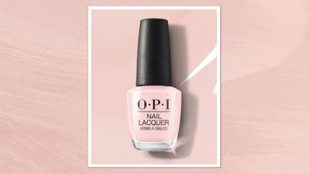 A product shot of OPI's Nail Lacquer in shade Put It In Neutral (which is a sheer, milky pink), pictured on a pink background - demonstrating the polishes colour - and featured in a pastel pink template