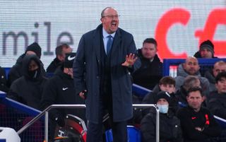 Everto manager Rafael Benitez standing, making a hand gesture on the touchline