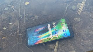A smartphone lying in a stream