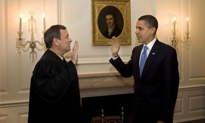John Roberts administers the oath of office to President Obama.