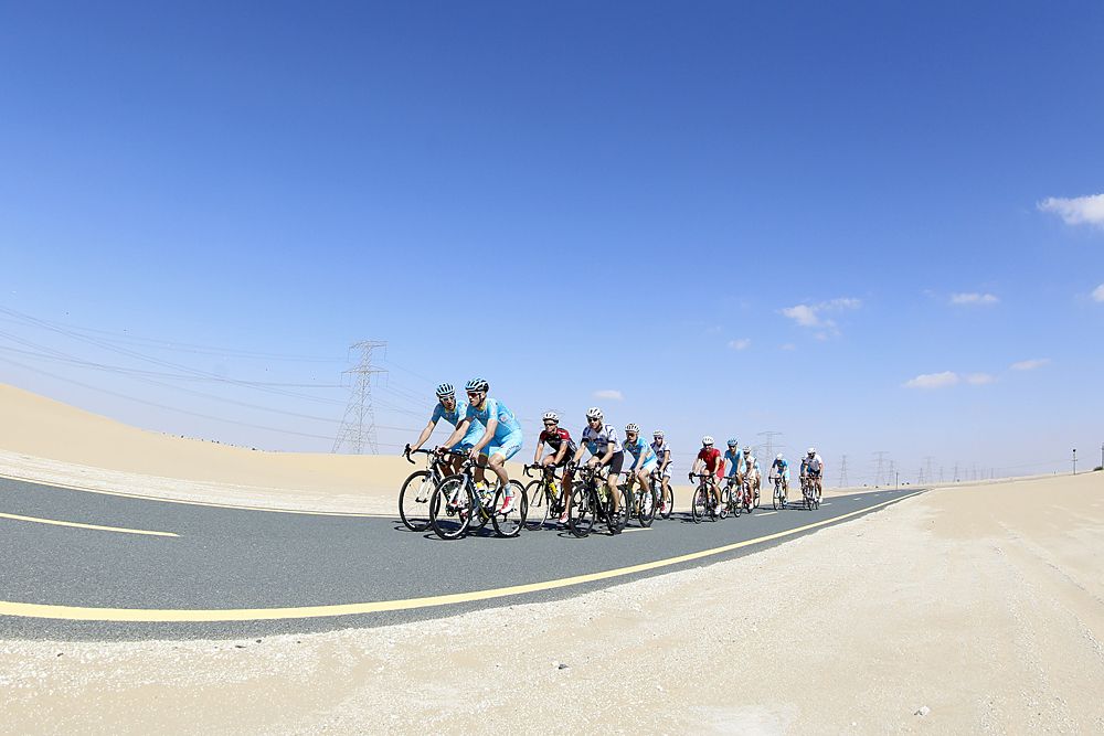 Riders shake out their legs before the team presentation