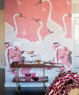 pink gucci heron wallpaper with a bar cart