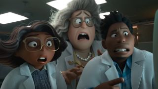 Scientists with shocked expressions on their faces as they look at a monitor in Hoppers.