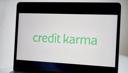 The green logo of Credit Karma on a white background on a laptop computer.