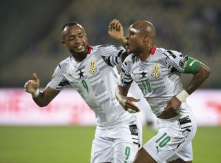 Brothers Andre and Jordan Ayew celebrate a goal for Ghana against Gabon in 2022.