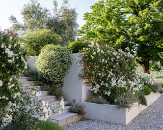Gravel garden ideas with raised bed planters