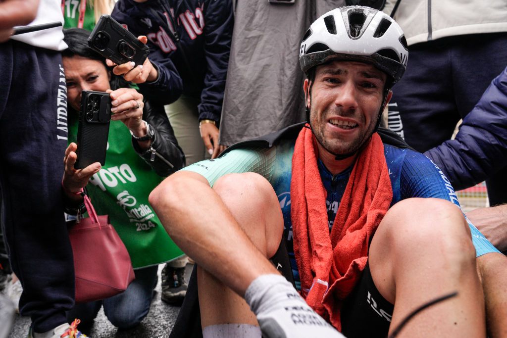 Team Decathlon AG2R's Italian rider Andrea Vendrame reacts as he celebrates after crossing the finish line to win the 19th stage of the 107th Giro d'Italia cycling race, 157km between Mortegliano and Sappada on May 24, 2024. (Photo by Marco Alpozzi / POOL / AFP)