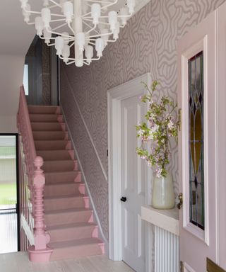 Pink entryway with wiggle pattern wallpaper