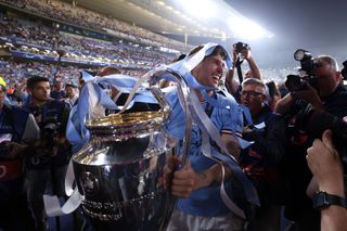 John Stones of Manchester City celebrates with the Champions League Trophy during the UEFA Champions League 2022/23 final match between FC Internazionale and Manchester City FC at Ataturk Olympic Stadium on June 10, 2023 in Istanbul, Turkey.