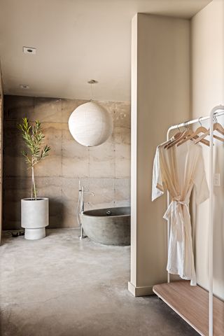 morning dove, a new house at twentynine palms by homestead modern, showing rammed earth walls, rough and contemporary volumes and windows out to desert landscape views