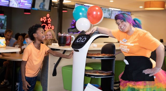 The BellaBot delivers food to a bowling alley lane at Stars and Strikes in Georgia. 