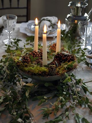 Table centerpiece with pine cones