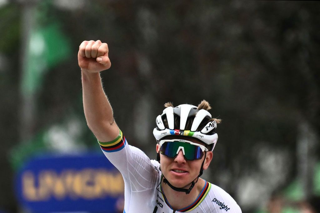 UAE Team Emirates team's Slovenian rider Tadej Pogacar celebrates his victory as he cycles to win the 118th edition of the Giro di Lombardia (Tour of Lombardy), a 252km cycling race from Bergamo to Como on October 12, 2024. (Photo by Marco BERTORELLO / AFP)