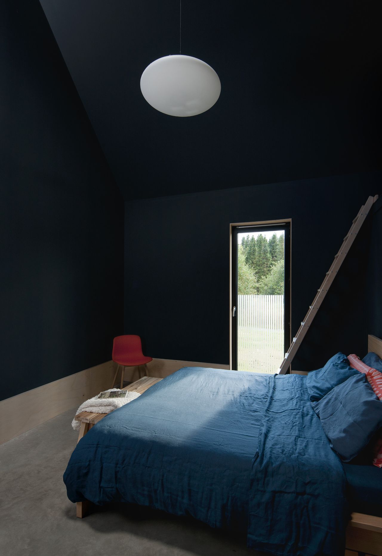 A bedroom with black walls