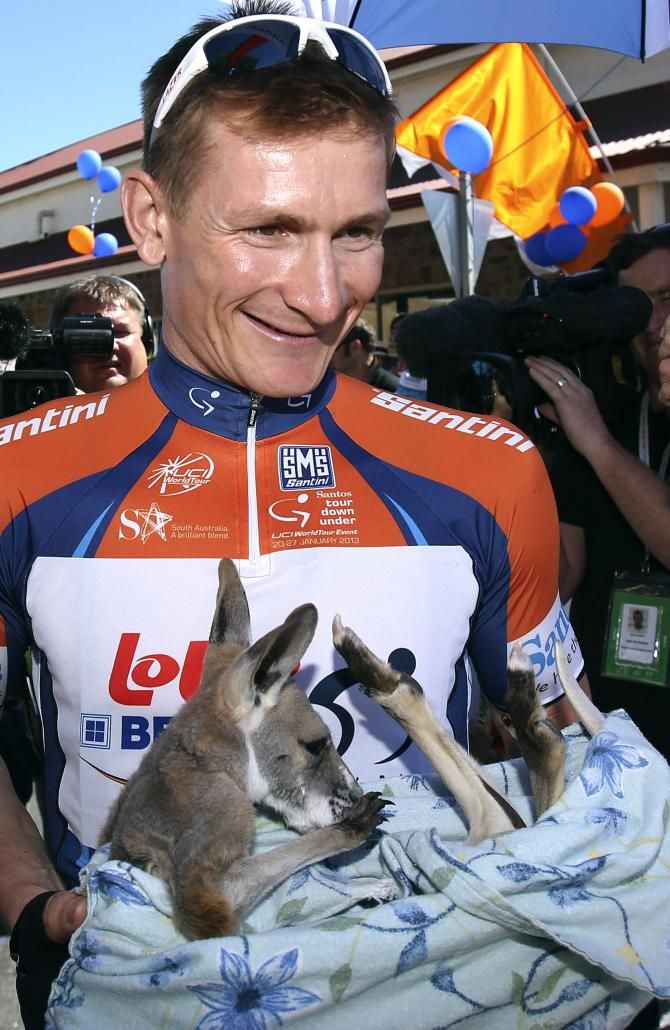 Andr&eacute; Greipel holds a joey