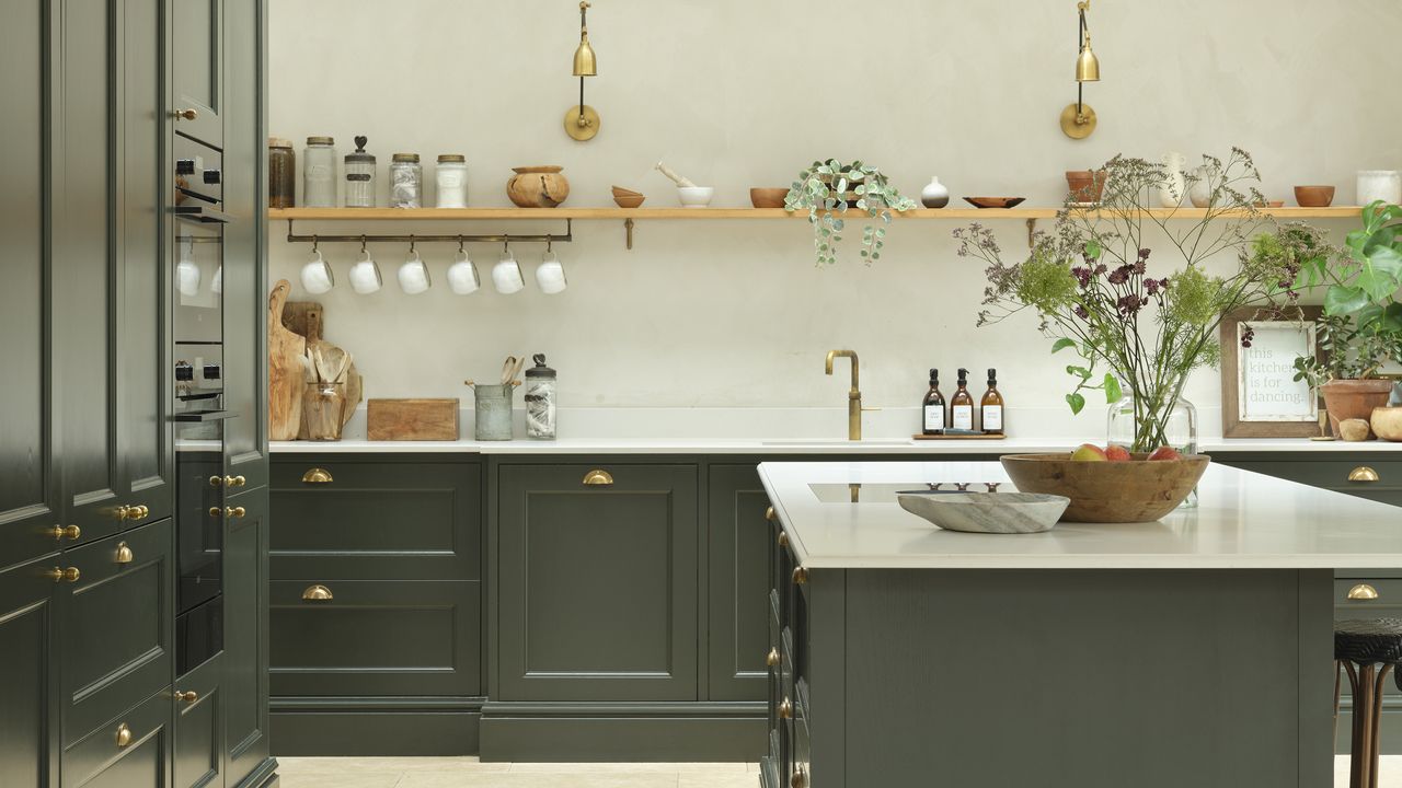 Black shaker kitchen with brass cup handles and open shelving