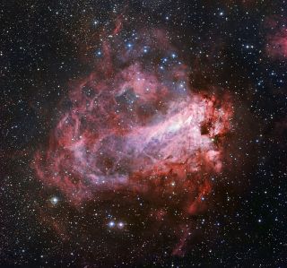 One of the sharpest images of the entire Messier 17 nebula was taken by the MPG/ESO 2.2-meter telescope at the European Southern Observatory's La Silla Observatory in Chile. Newly formed stars can be seen within the rose-colored dust.