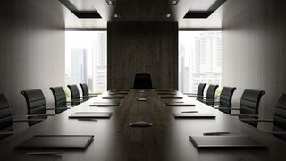 Board meeting room with empty chairs