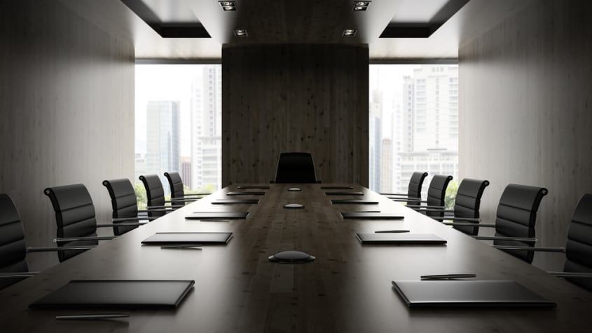 Board meeting room with empty chairs