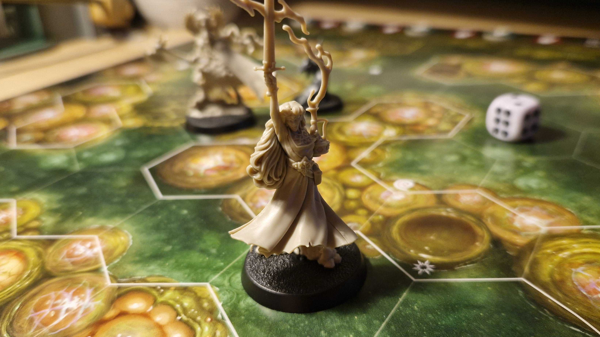 Warhammer Quest models and dice laid out on the board