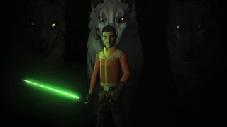 Screenshot from the animated T.V. show Star Wars Rebels. Adult Ezra Bridger (male, short dark blue hair, thick eyebrows, orange and brown jacket) is holding a green lightsaber in his right hand and a blaster gun in his left. Out of the darkness behind him, backing up Ezra, are three giant Loth-wolves (giant gray wolves with piercing yellow eyes).